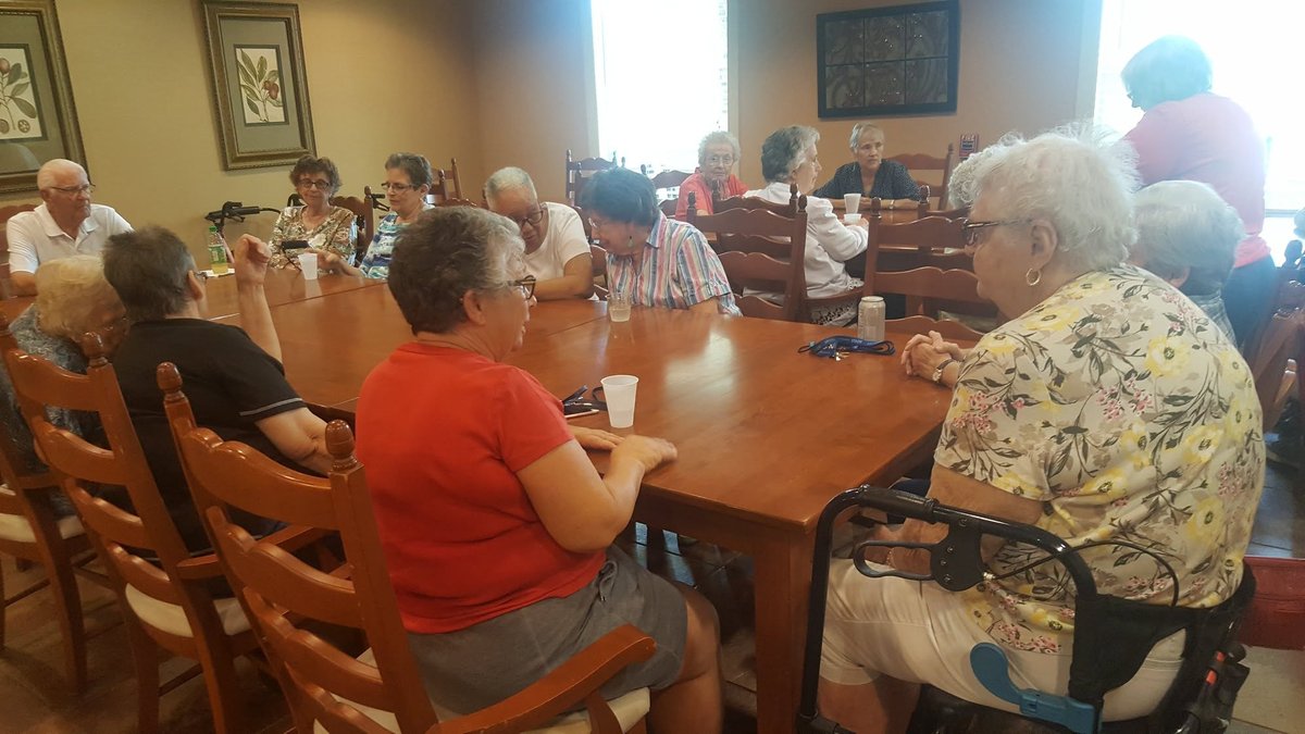 Seniors gathered at a community dining event