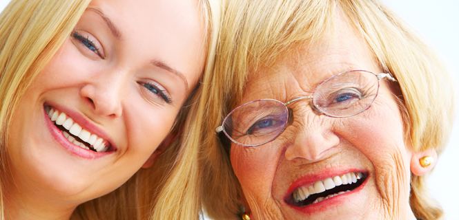 Caregiver and senior client sharing a joyful moment